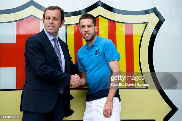 Barcelona President Sandro Rosell and Jordi Alba shake hands during the official presentation of Jordi Alba as the new signing for FC Barcelona at...