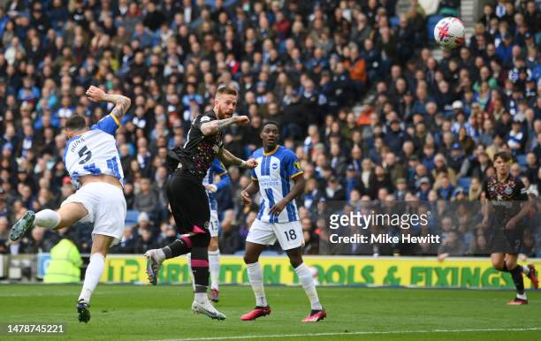 Pontus Jansson of Brentford scores the team's first goal during the Premier League match between Brighton & Hove Albion and Brentford FC at American...