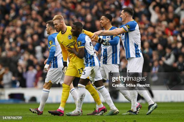 Jason Steele of Brighton & Hove Albion celebrates with teammates after the team's first goal scored by Kaoru Mitoma during the Premier League match...