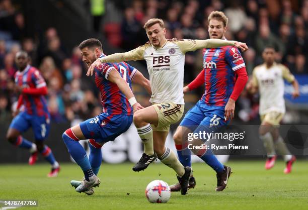 James Justin of Leicester City is challenged by Joel Ward and Joachim Andersen of Crystal Palace during the Premier League match between Crystal...