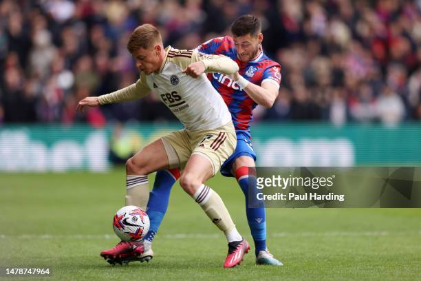 Harvey Barnes of Leicester City battles for possession with Joel Ward of Crystal Palace during the Premier League match between Crystal Palace and...