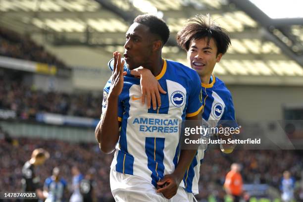 Danny Welbeck of Brighton & Hove Albion celebrates with teammate Kaoru Mitoma after scoring the team's second goal during the Premier League match...