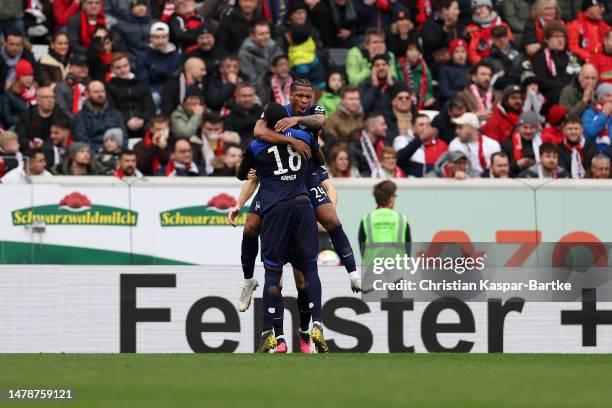 Kimberly Ezekwem of Sport-Club Freiburg celebrates with teammates after scoring the team's first goal during the Bundesliga match between Sport-Club...