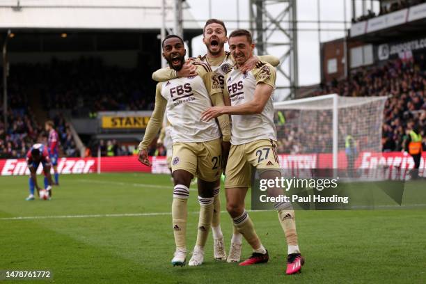 Ricardo Pereira of Leicester City celebrates with teammates Timothy Castagne and James Maddison after scoring the team's first goal during the...