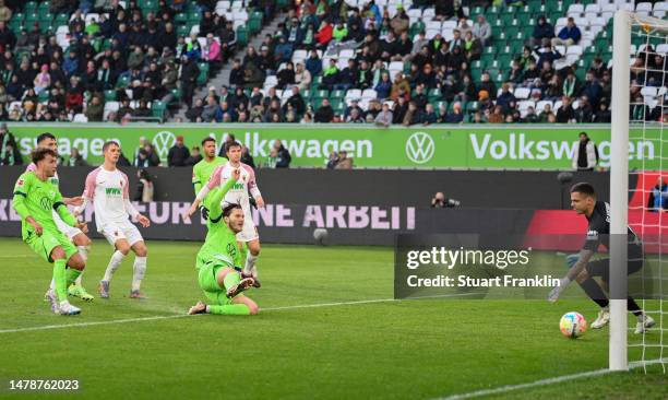 Luca Waldschmift of VfL Wolfsburg scores the team's first goal during the Bundesliga match between VfL Wolfsburg and FC Augsburg at Volkswagen Arena...