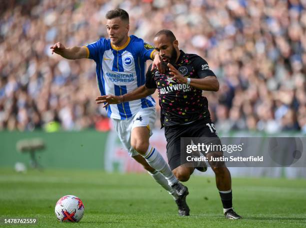 Bryan Mbeumo of Brentford battles for possession with Joel Veltman of Brighton & Hove Albion during the Premier League match between Brighton & Hove...