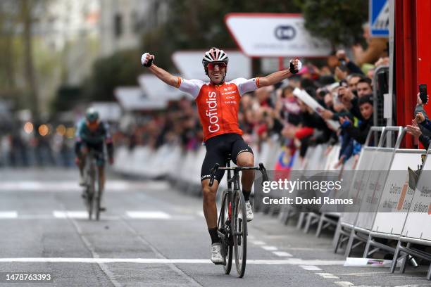 Ion Izaguirre of Spain and Team Cofidis celebrates at finish line as race winner ahead of Sergio Andres Higuita Garcia of Colombia and Team BORA –...