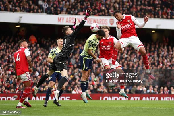 Gabriel of Arsenal wins a header whilst under pressure from Illan Meslier of Leeds United during the Premier League match between Arsenal FC and...