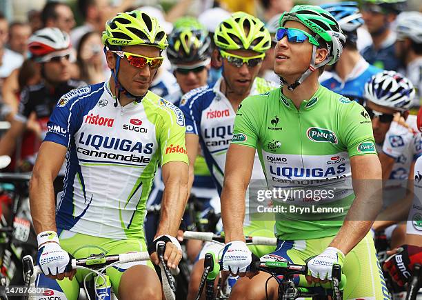 Peter Sagan of Slovakia and Liquigas-Canondale chats to team mate Ivan Basso of Italy at the start of stage five of the 2012 Tour de France from...