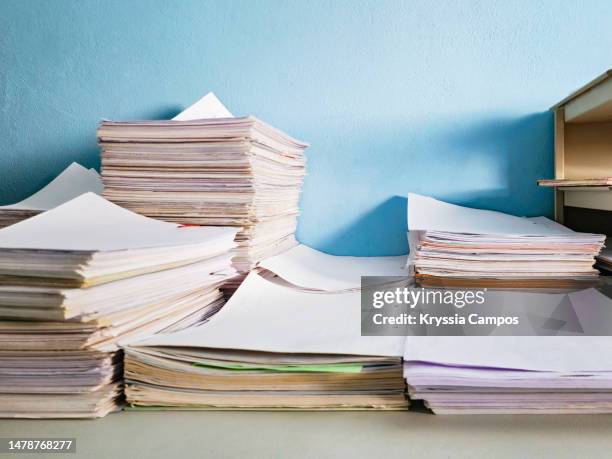 piles of papers and documents on a work table - document stack stock pictures, royalty-free photos & images