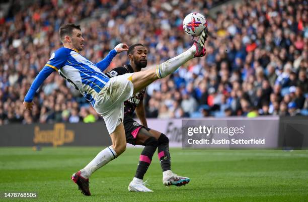 Pascal Gross of Brighton & Hove Albion on the ball whilst under pressure from Rico Henry of Brentford during the Premier League match between...