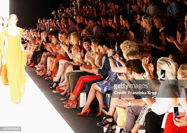 Noah Becker, Jana Ina Zarella, Giovanni Zarrella and Dana Schweiger sit in the front row of the Laurel Show during the Mercedes-Benz Fashion Week...