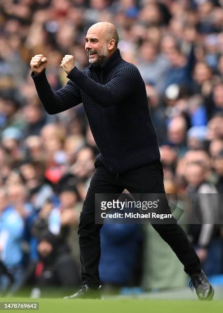 Pep Guardiola, Manager of Manchester City, celebrates after their sides third goal scored by Ilkay Guendogan of Manchester City during the Premier...