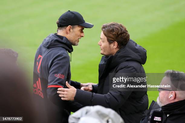 Thomas Tuchel, Head Coach of FC Bayern Munich, interacts with Edin Terzic, Head Coach of Borussia Dortmund, prior to the Bundesliga match between FC...