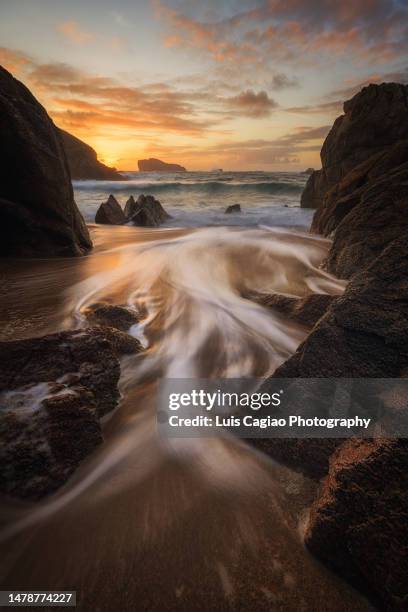waves arriving to a lonely beach in the northwestern coast of spain in spring - ferrol stock pictures, royalty-free photos & images