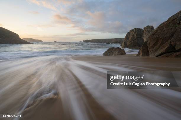 waves arriving to a lonely beach in the northwestern coast of spain in spring - ferrol stock pictures, royalty-free photos & images