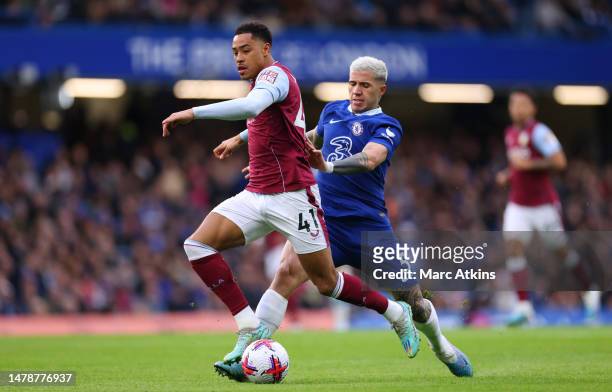 Jacob Ramsey of Aston Villa battles for possession with Enzo Fernandez of Chelsea during the Premier League match between Chelsea FC and Aston Villa...