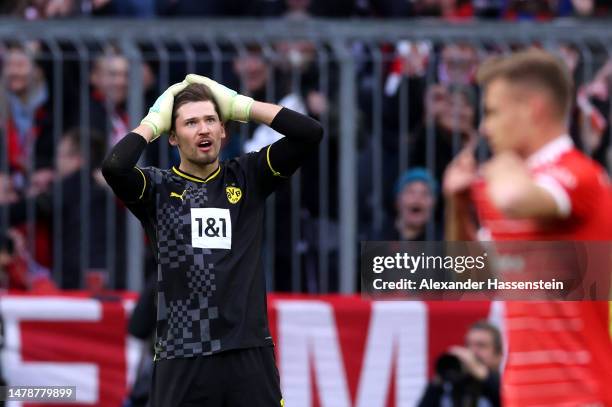 Gregor Kobel of Borussia Dortmund reacts after scoring an own goal during the Bundesliga match between FC Bayern München and Borussia Dortmund at...