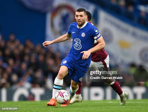 Mateo Kovacic of Chelsea runs with the ball during the Premier League match between Chelsea FC and Aston Villa at Stamford Bridge on April 01, 2023...