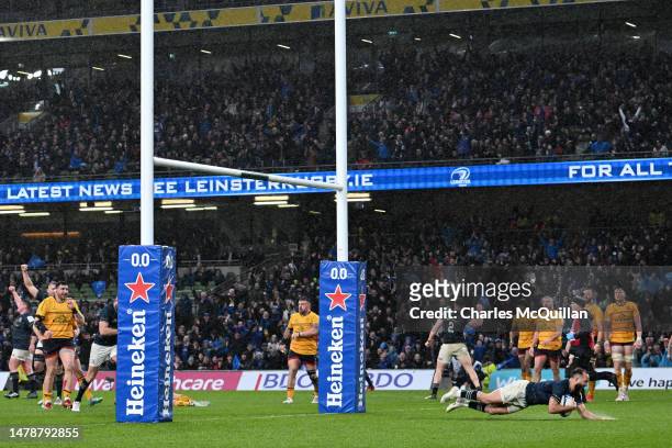 Jamison Gibson-Park of Leinster scores the team's second try during the Heineken Champions Cup Round of Sixteen match between Leinster Rugby and...