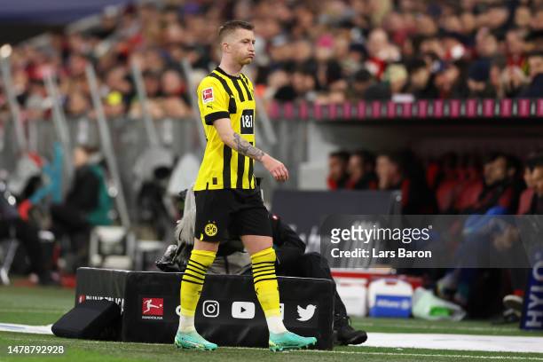 Marco Reus of Borussia Dortmund looks dejected as he leaves the pitch after being subbed off during the Bundesliga match between FC Bayern München...