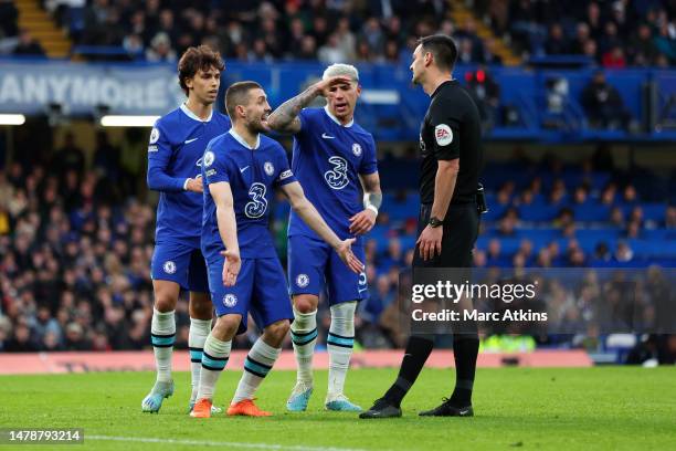 Mateo Kovacic, Joao Felix and Enzo Fernandez of Chelsea appeal to referee, Andrew Madley for a penalty during the Premier League match between...