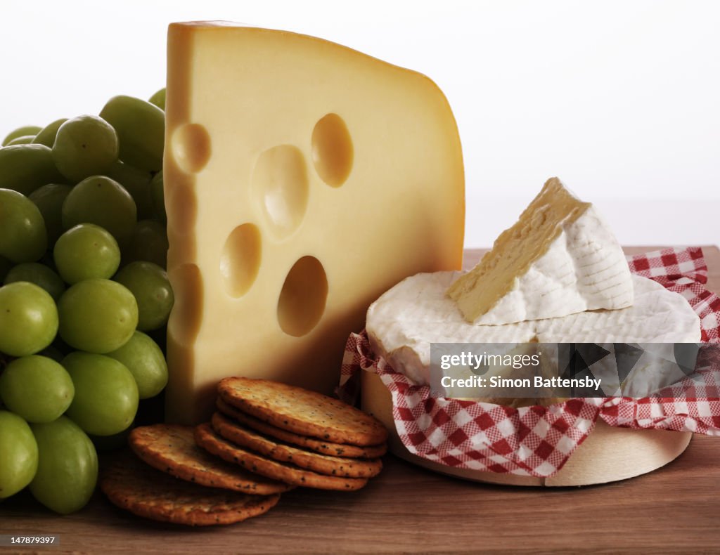 Biscuits, grapes and continental cheeses
