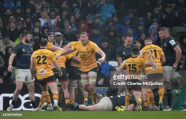 Ulster players celebrate the team's second try scored by Rob Herring during the Heineken Champions Cup Round of Sixteen match between Leinster Rugby...