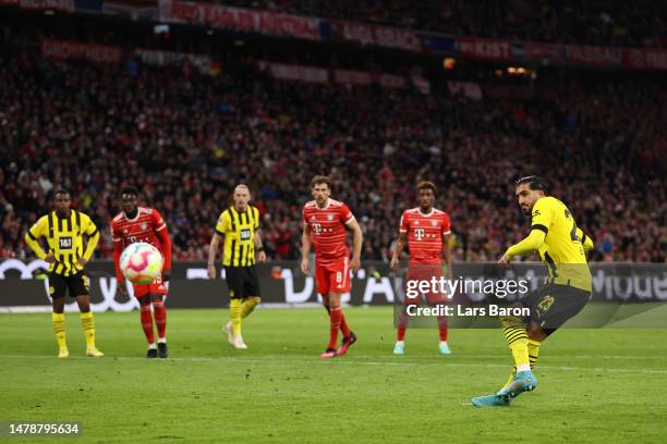 Emre Can of Borussia Dortmund scores the team's first goal via a penalty kick during the Bundesliga match between FC Bayern München and Borussia...