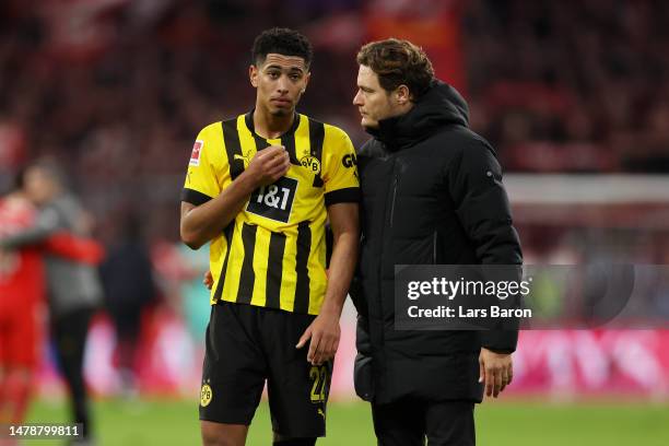 Jude Bellingham of Borussia Dortmund looks dejected as he interacts with Edin Terzic, Head Coach of Borussia Dortmund, following the Bundesliga match...