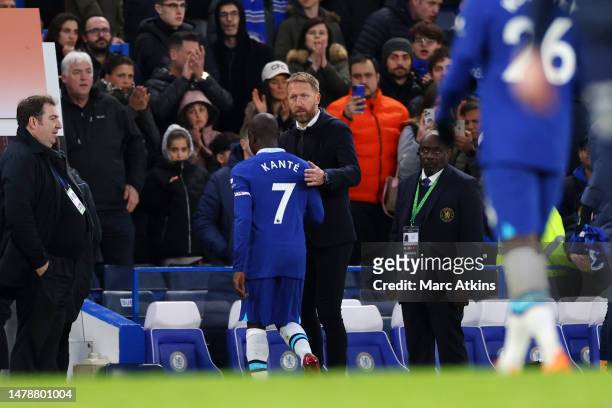 Graham Potter, Manager of Chelsea, interacts with Ngolo Kante of Chelsea following the Premier League match between Chelsea FC and Aston Villa at...