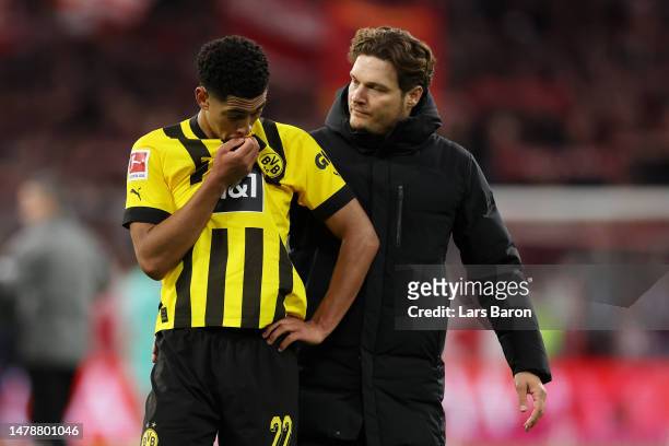 Jude Bellingham of Borussia Dortmund looks dejected as he interacts with Edin Terzic, Head Coach of Borussia Dortmund, following the Bundesliga match...