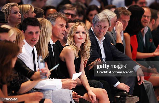 Poppy Delevingne, HUGO BOSS CEO Claus-Dietrich Lahrs, Kate Bosworth and Berlin mayor Klaus Wowereit sit in front row during the Hugo By Hugo Boss...