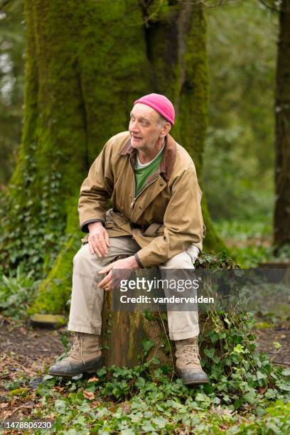 elderly man out in the woods - pink pants stock pictures, royalty-free photos & images