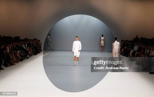 Model walks the runway during the Hugo By Hugo Boss Show at the Mercedes-Benz Fashion Week Spring/Summer 2013 on July 5, 2012 in Berlin, Germany.