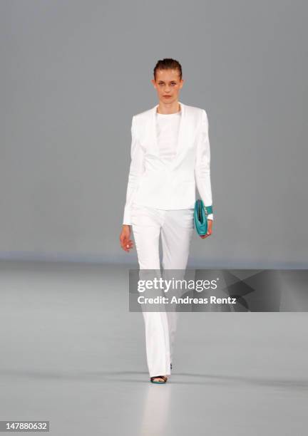 Model walks the runway during the Hugo By Hugo Boss Show at the Mercedes-Benz Fashion Week Spring/Summer 2013 on July 5, 2012 in Berlin, Germany.