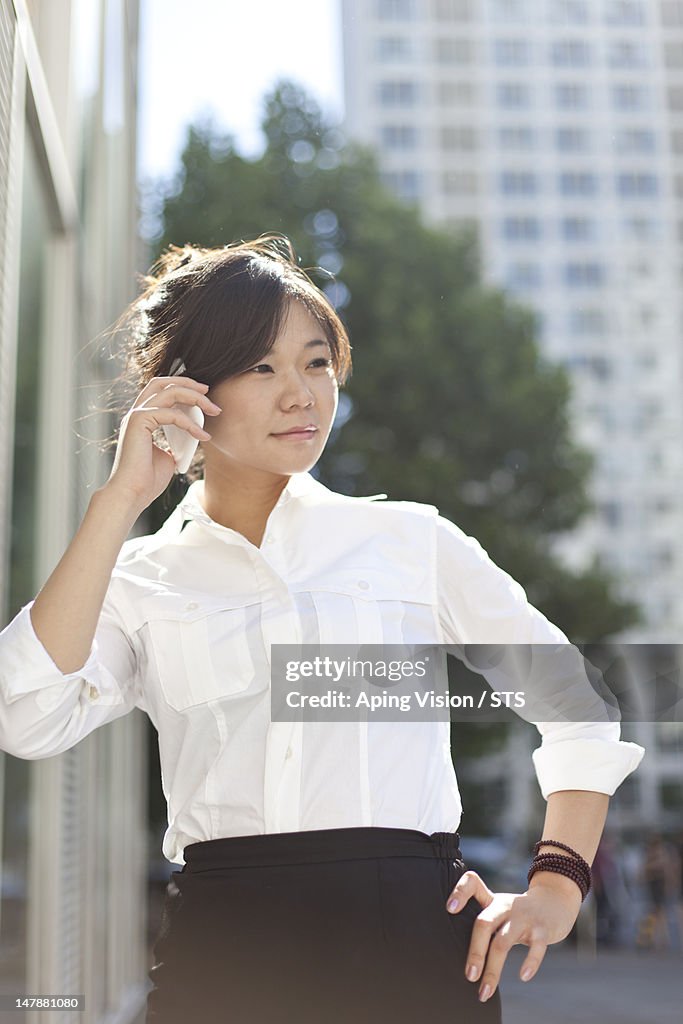 Businesswoman calling by phone
