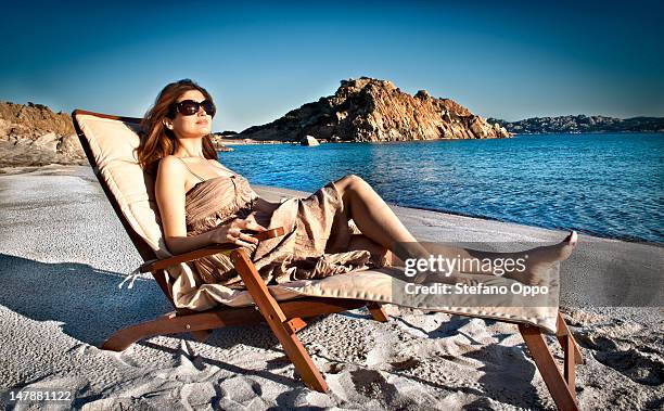 woman in a deck chair - insel maddalena stock-fotos und bilder