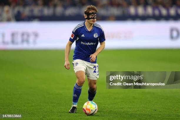 Cedric Brunner of Schalke in action during the Bundesliga match between FC Schalke 04 and Bayer 04 Leverkusen at Veltins-Arena on April 01, 2023 in...