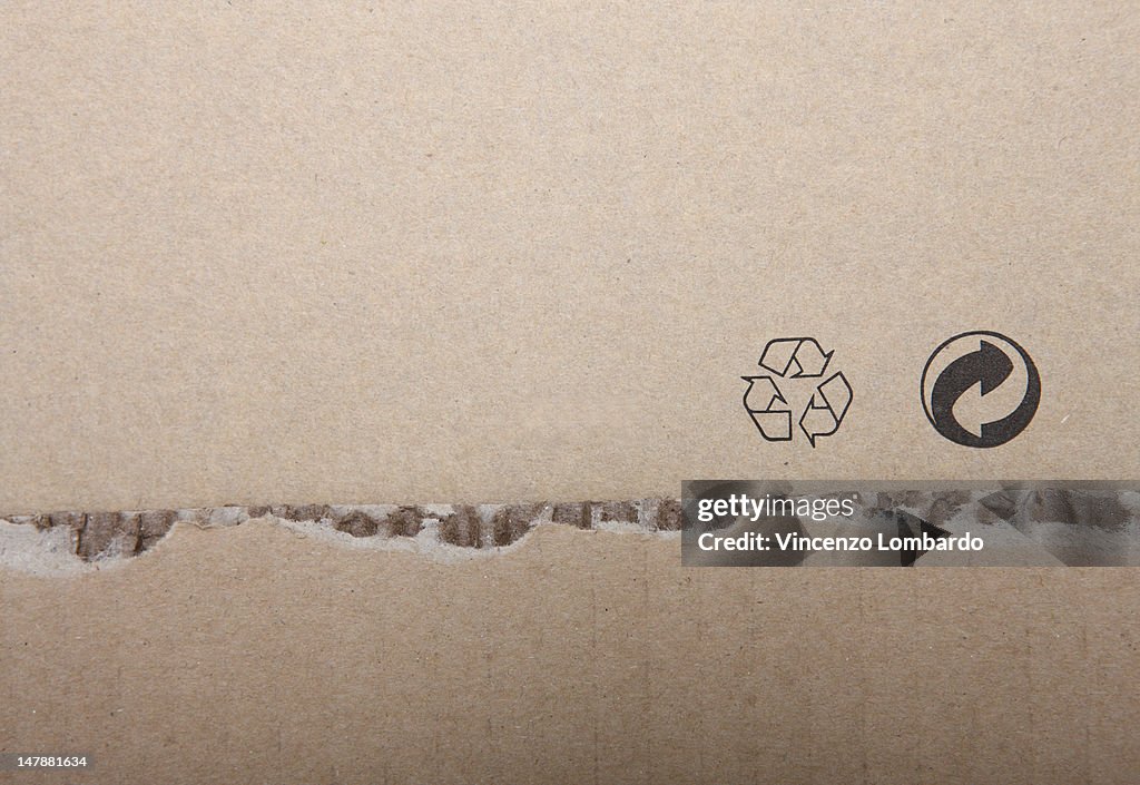 Cardboard box with printed recycling symbols