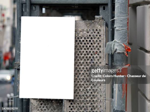 an empty rectangular panel fixed on the metal structure of a scaffolding in paris, france - way foundation stock pictures, royalty-free photos & images