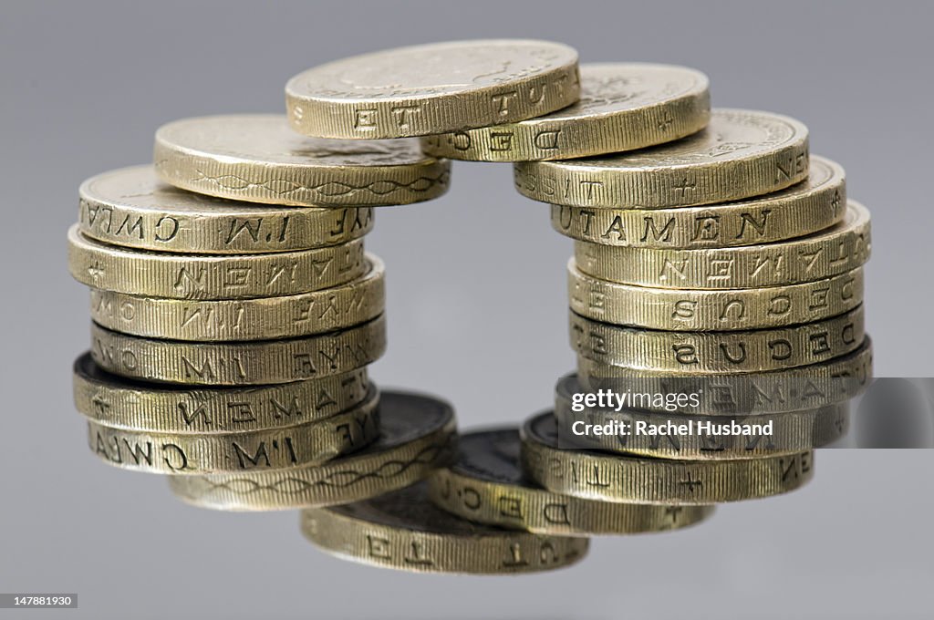 Reflection of sterling pound coins making a circle