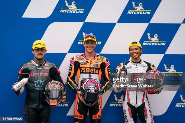 Moto2 Top-3 riders at parc ferme with Moto2 rider Aron Canet of Spain and Pons Wegow Los40 , Moto2 rider Alonso Lopez of Spain and SpeedUp Racing and...