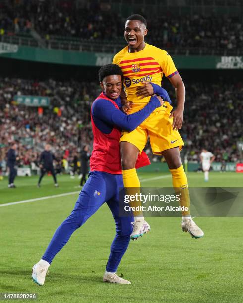 Ansu Fati of FC Barcelona celebrates with teammate Alejandro Balde after scoring the team's second goal during the LaLiga Santander match between...