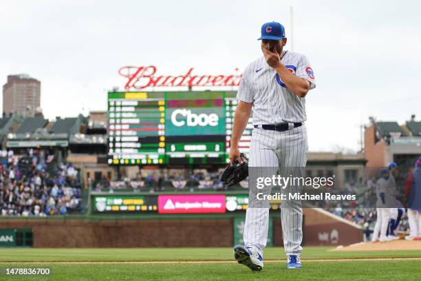 Michael Fulmer of the Chicago Cubs reacts after being removed from the game during the eighth inning against the Milwaukee Brewers at Wrigley Field...