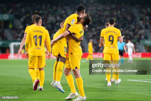 Ansu Fati of FC Barcelona celebrates with Jordi Alba of FC Barcelona after scoring the team's first goal during the LaLiga Santander match between...