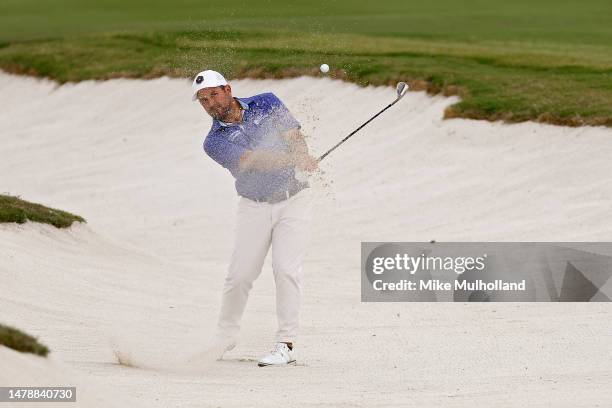 Roberto Diaz of Mexico plays his shot from the bunker on the 14th hole during the third round of the Valero Texas Open at TPC San Antonio on April...