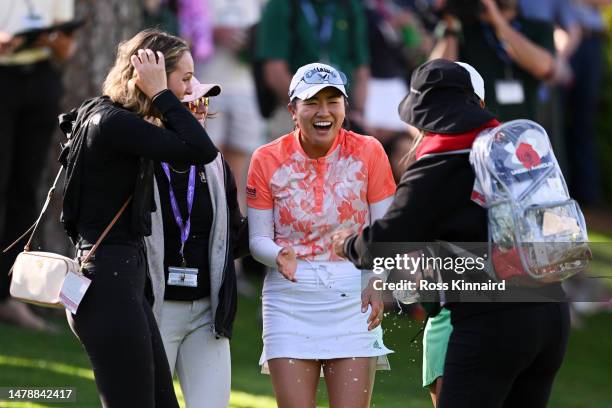 Rose Zhang of the United States celebrates on the 10th green, the second playoff hole, after defeating Jenny Bae of the United States to win during...