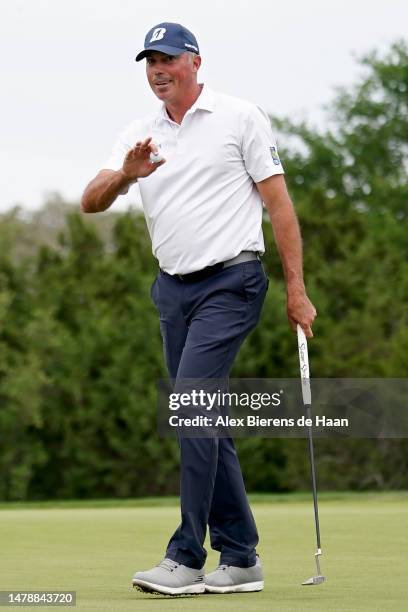 Matt Kuchar of the United States reacts after making birdie on the 17th green during the third round of the Valero Texas Open at TPC San Antonio on...