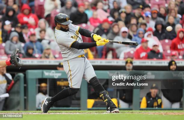 Carlos Santana the Pittsburgh Pirates hits a single in the third inning against the Cincinnati Reds at Great American Ball Park on April 01, 2023 in...